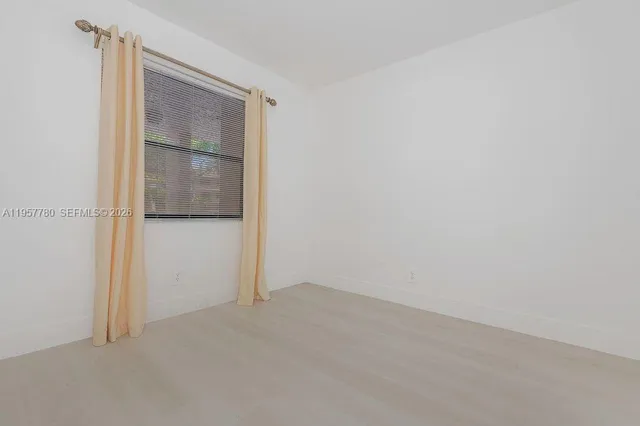 an empty room with mirror