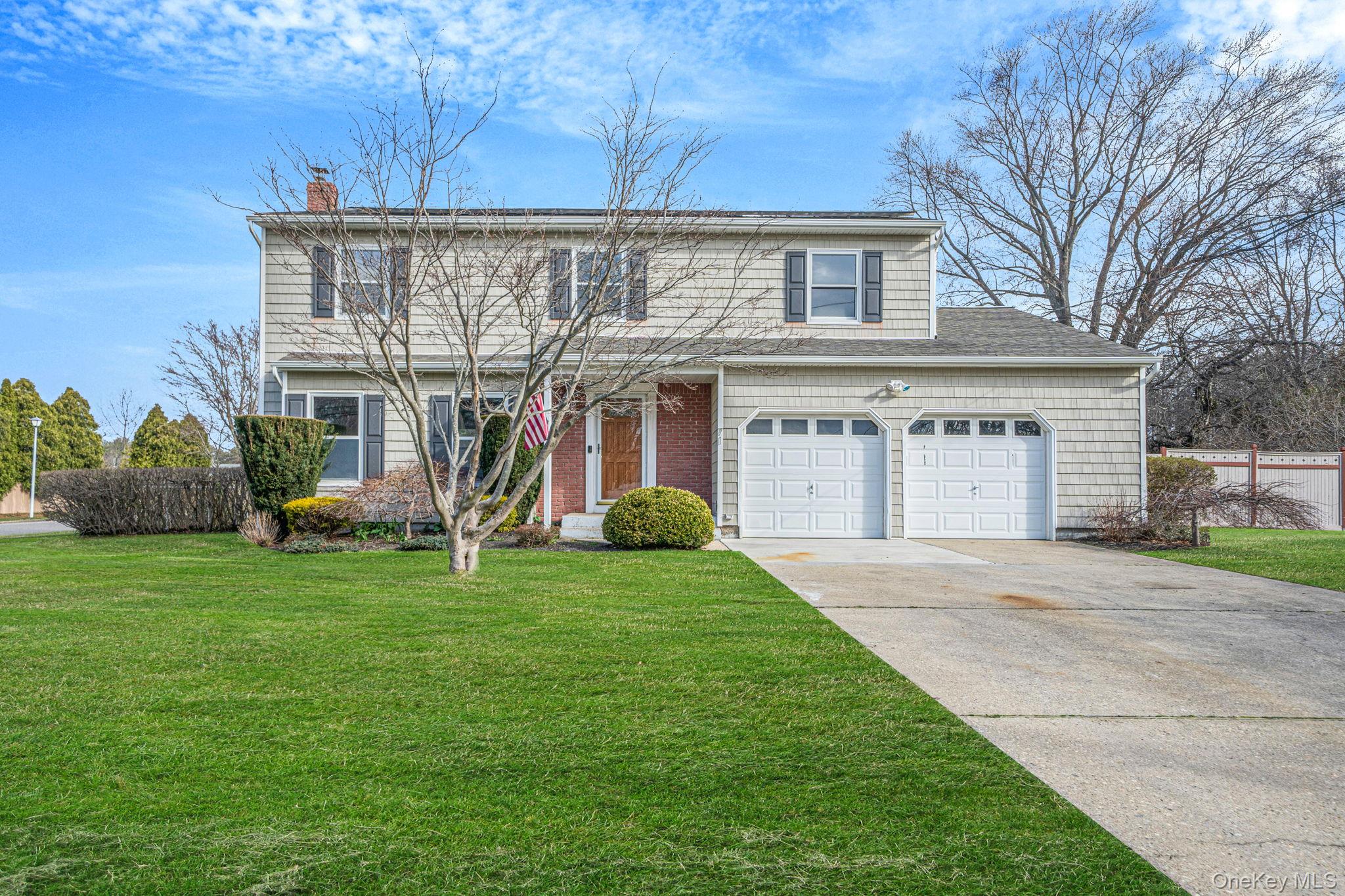 71 Loop Drive Sayville, NY 11782 - Photo 1 of 45 front view of a house with a yard