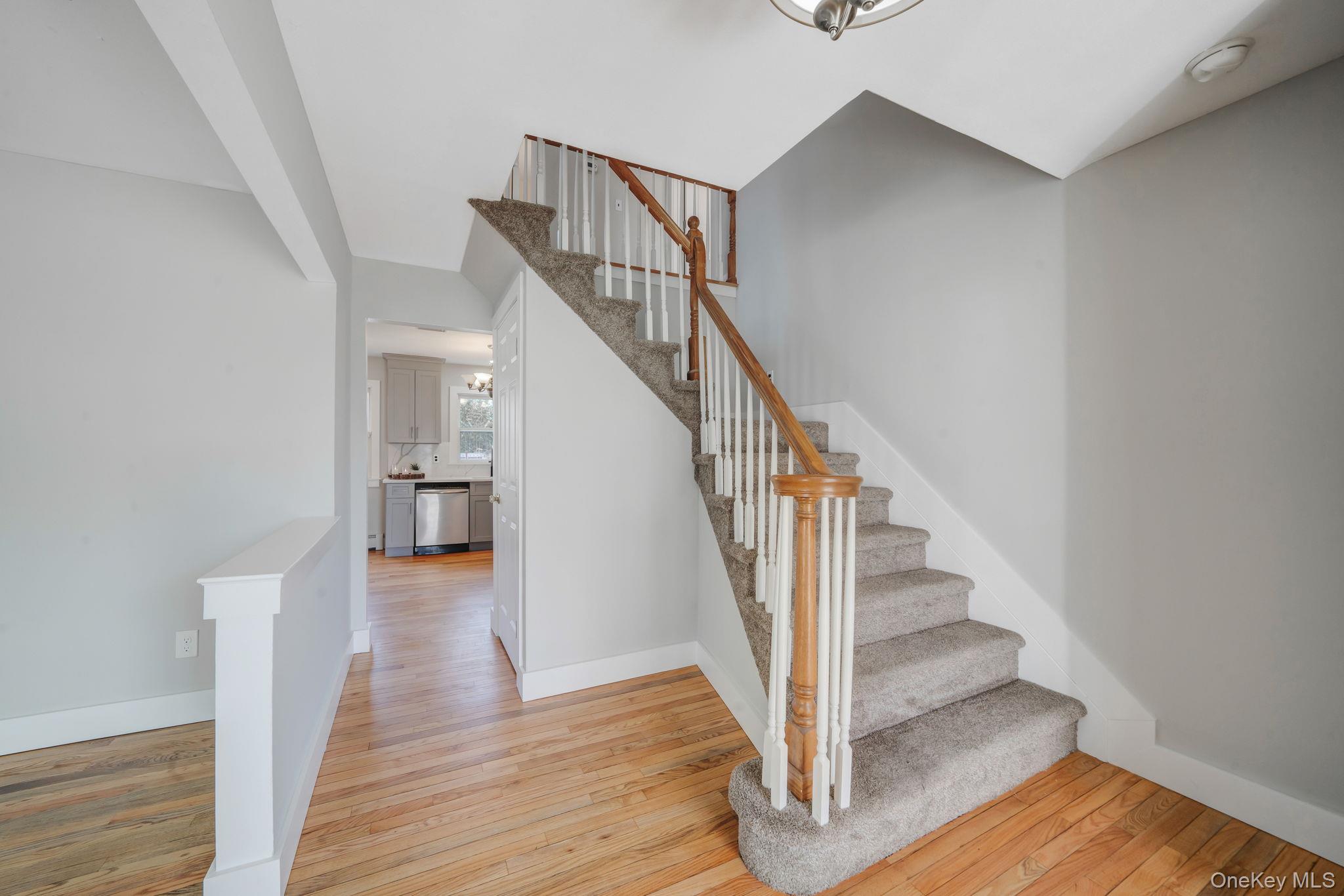 71 Loop Drive Sayville, NY 11782 - Photo 19 of 45 a view of entryway and hall with wooden floor