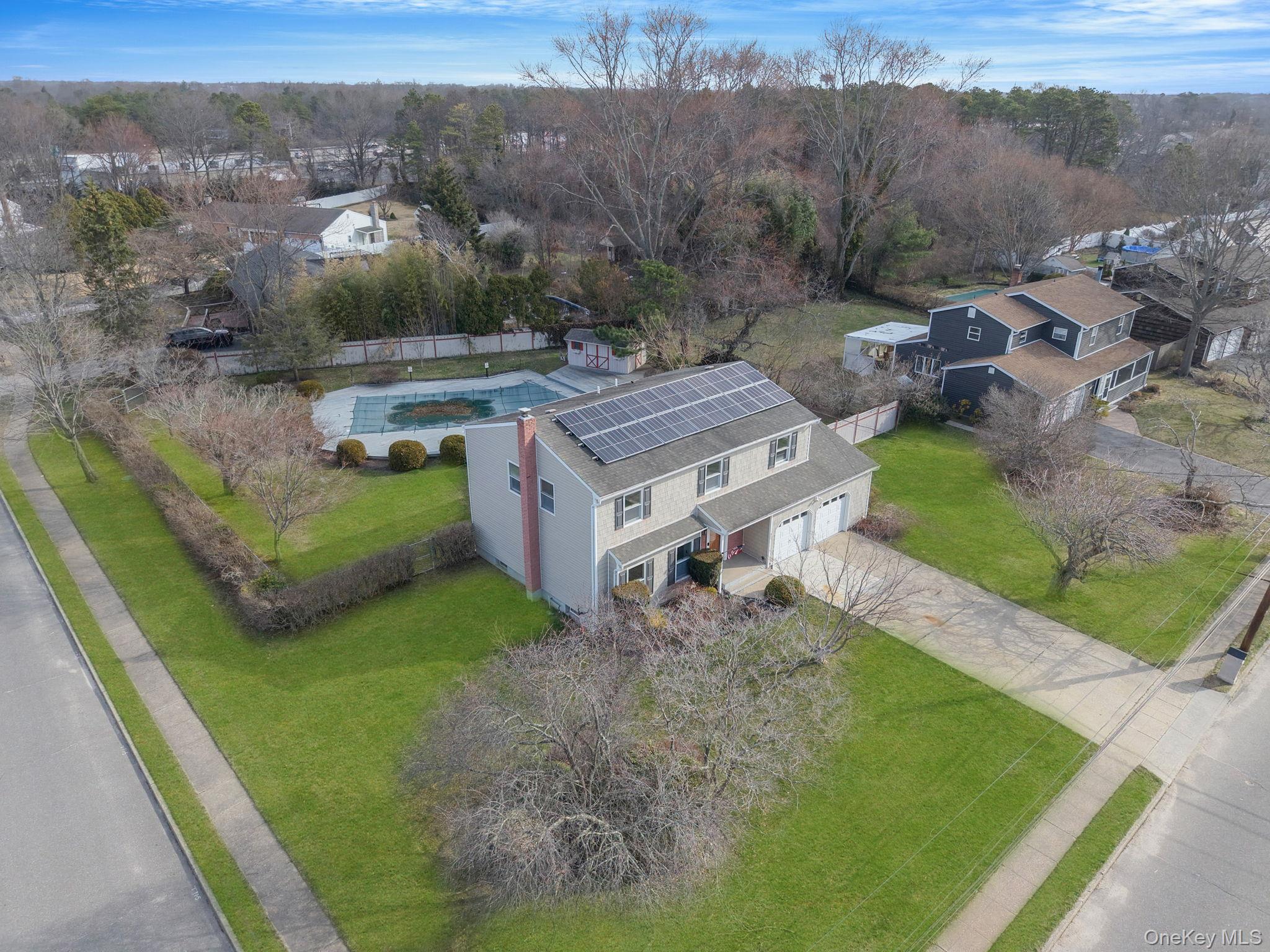 71 Loop Drive Sayville, NY 11782 - Photo 2 of 45 a view of a house with a yard