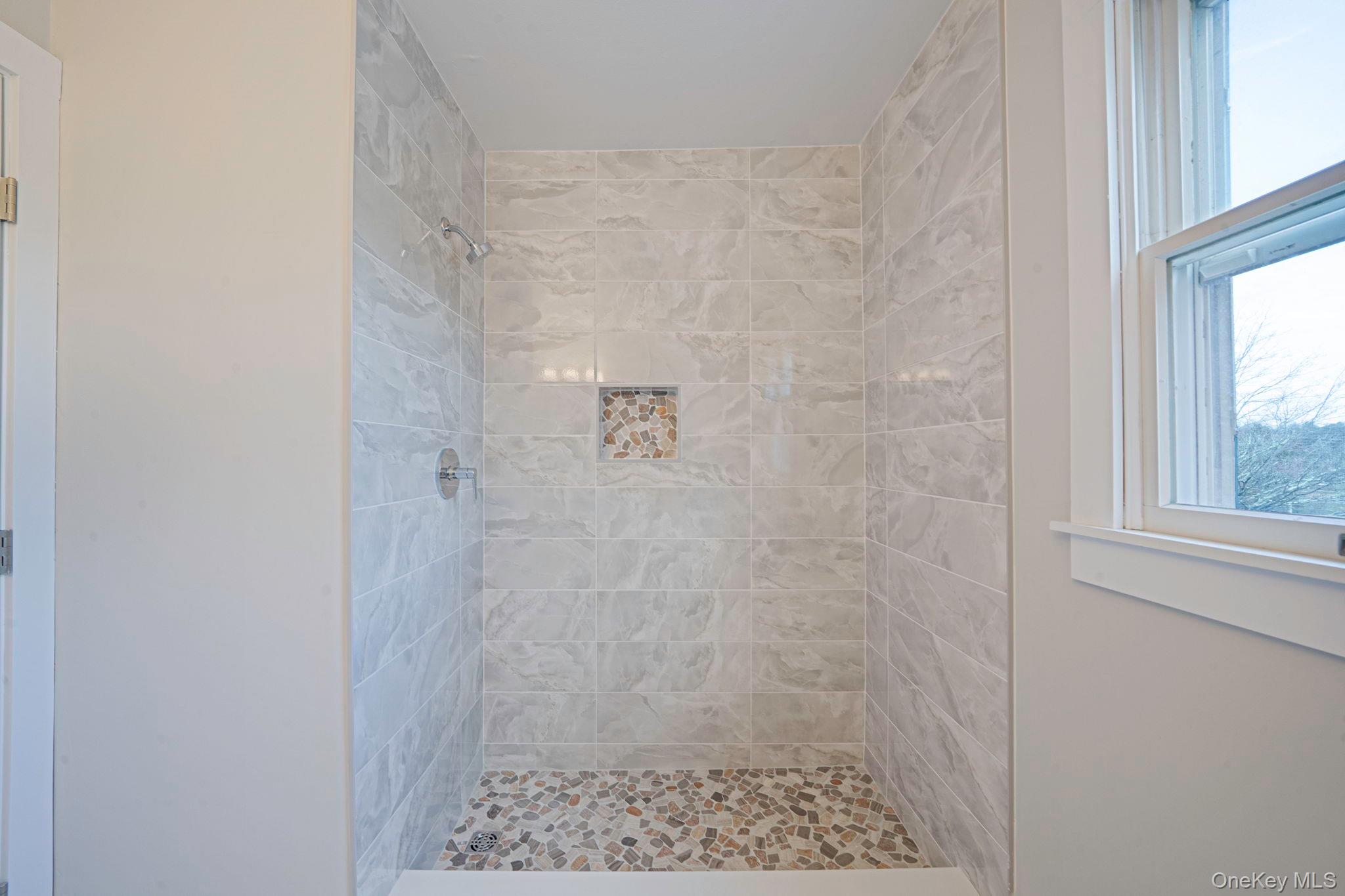 71 Loop Drive Sayville, NY 11782 - Photo 25 of 45 a bathroom with a shower