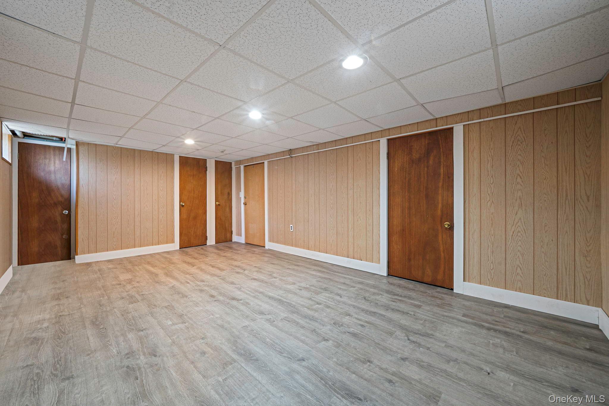 71 Loop Drive Sayville, NY 11782 - Photo 35 of 45 a view of an empty room with wooden floor