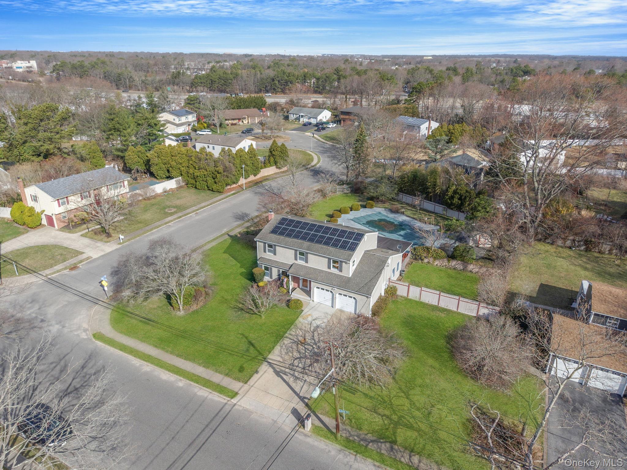 71 Loop Drive Sayville, NY 11782 - Photo 38 of 45 an aerial view of a house with a yard
