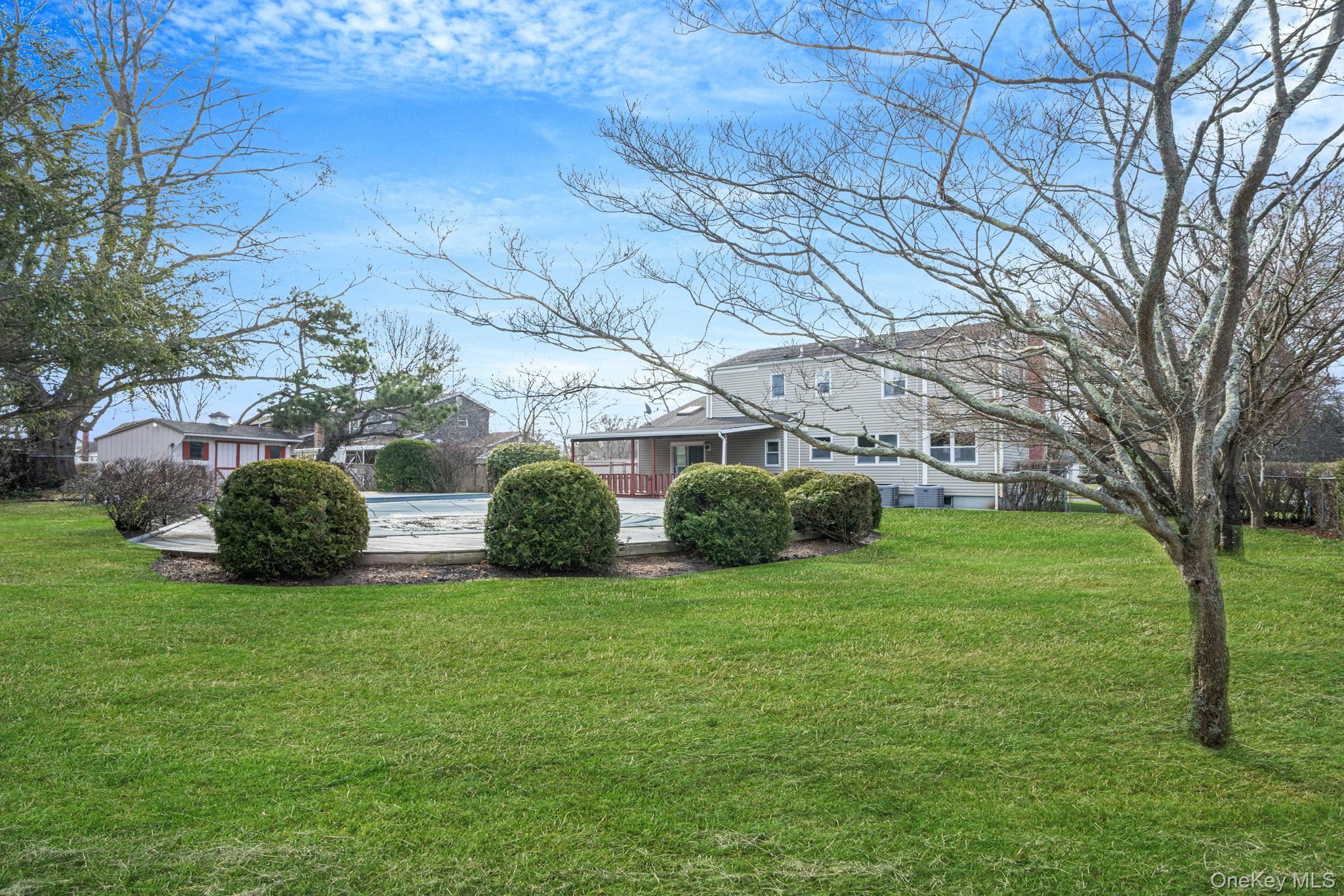 71 Loop Drive Sayville, NY 11782 - Photo 40 of 45 a view of a house with backyard