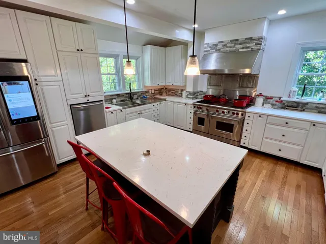 a bath tub sitting next to a window