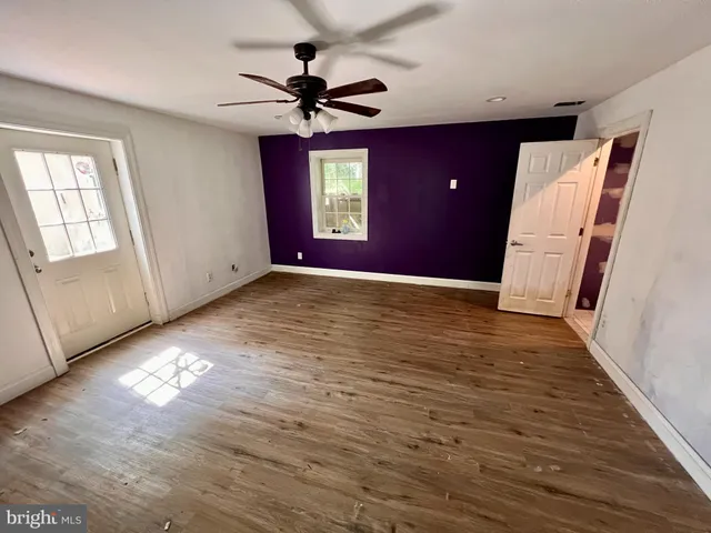 a outdoor living room with furniture and a wooden floor
