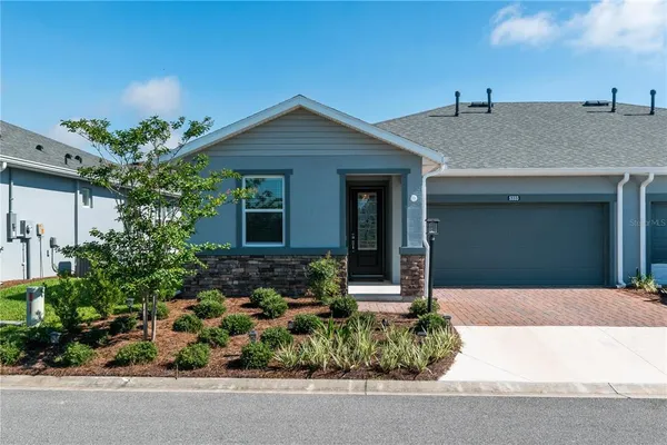 front view of a house with a yard