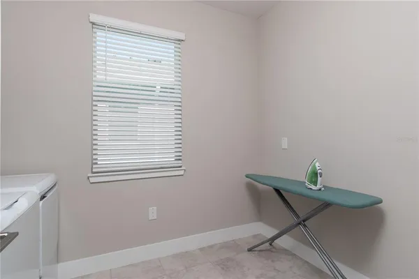 a view of a workspace room with a window