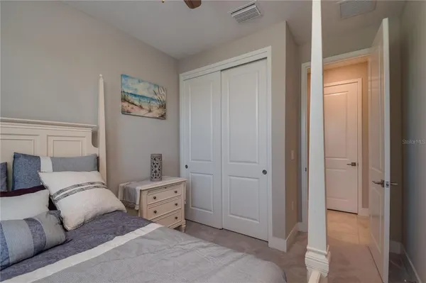 a room with a bed and a cabinets