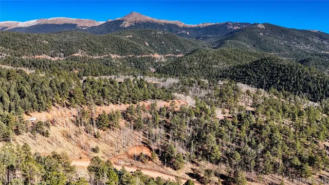 a view of mountains and valleys