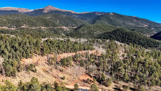 a view of mountains and valleys