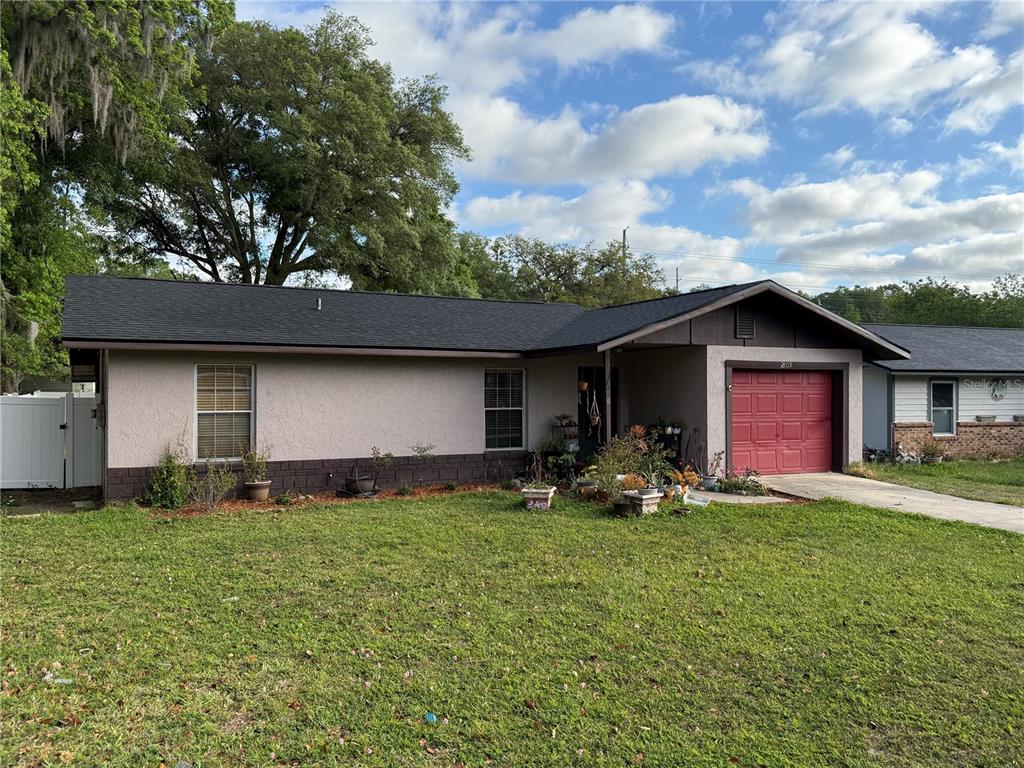 1805 Northeast 29th Place Ocala, FL 34479 - Photo 1 of 1 a front view of house with yard and seating space