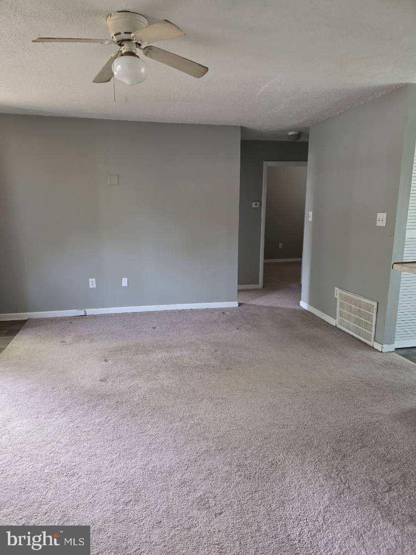 10 Archer Circle Newark, DE 19702 - Photo 3 of 12 a view of an empty room with a fan
