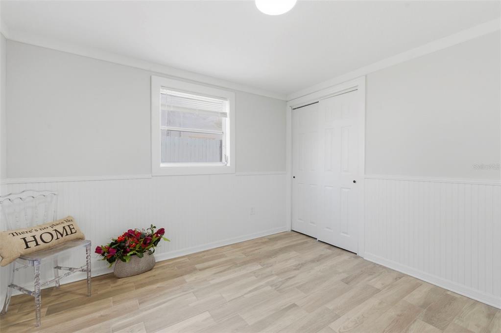 9033 Pegasus Avenue Port Richey, FL 34668 - Photo 32 of 56 a view of a room with wooden floor and cabinet
