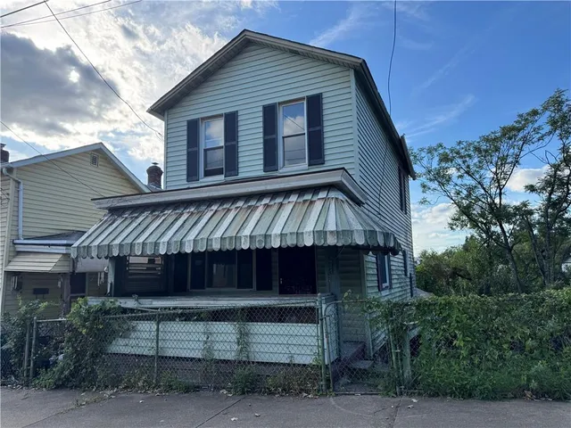a front view of a house with a balcony