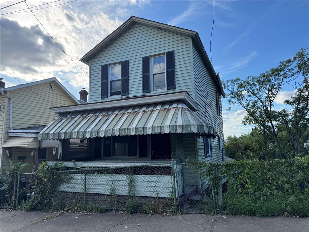 a front view of a house with a balcony