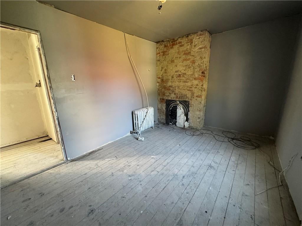 809 Middle Street Braddock, PA 15104 - Photo 16 of 26 a view of an empty room with a fireplace