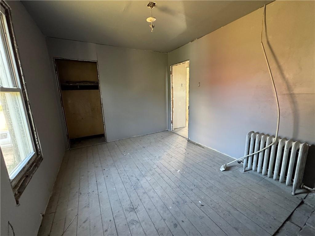 809 Middle Street Braddock, PA 15104 - Photo 17 of 26 a view of a hallway with wooden floor and stairs