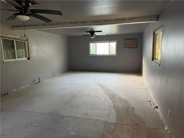 a view of an empty room and window