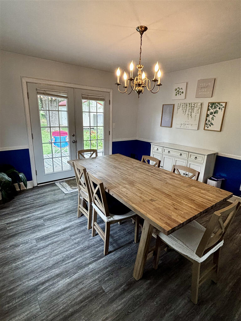 1032 Windy Ridge Drive Bedford, VA 24523 - Photo 10 of 27 a view of a dining room with furniture wooden floor and chandelier