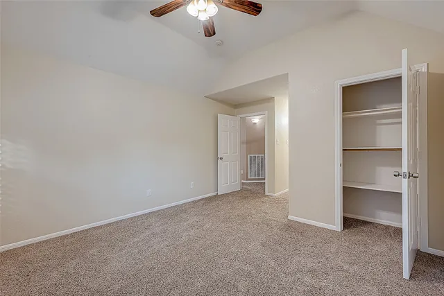 a bathroom with a granite countertop shower sink and mirror
