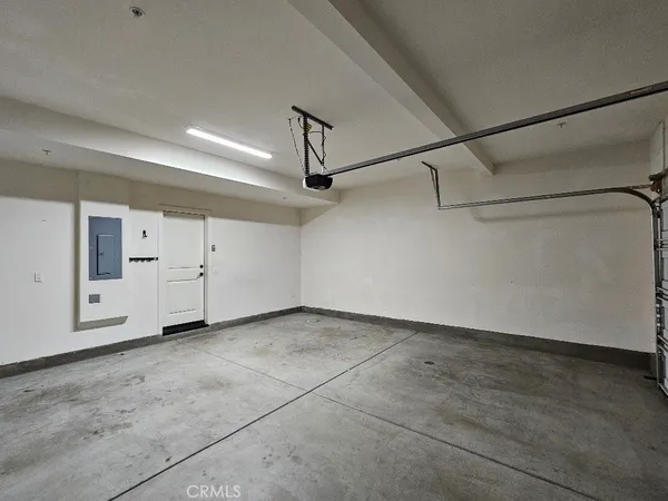a view of a room with white walls and wooden floors