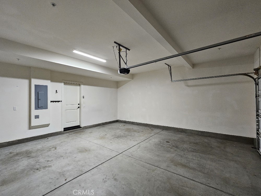 44011 Rivo Court Temecula, CA 92592 - Photo 12 of 39 a view of a room with white walls and wooden floors