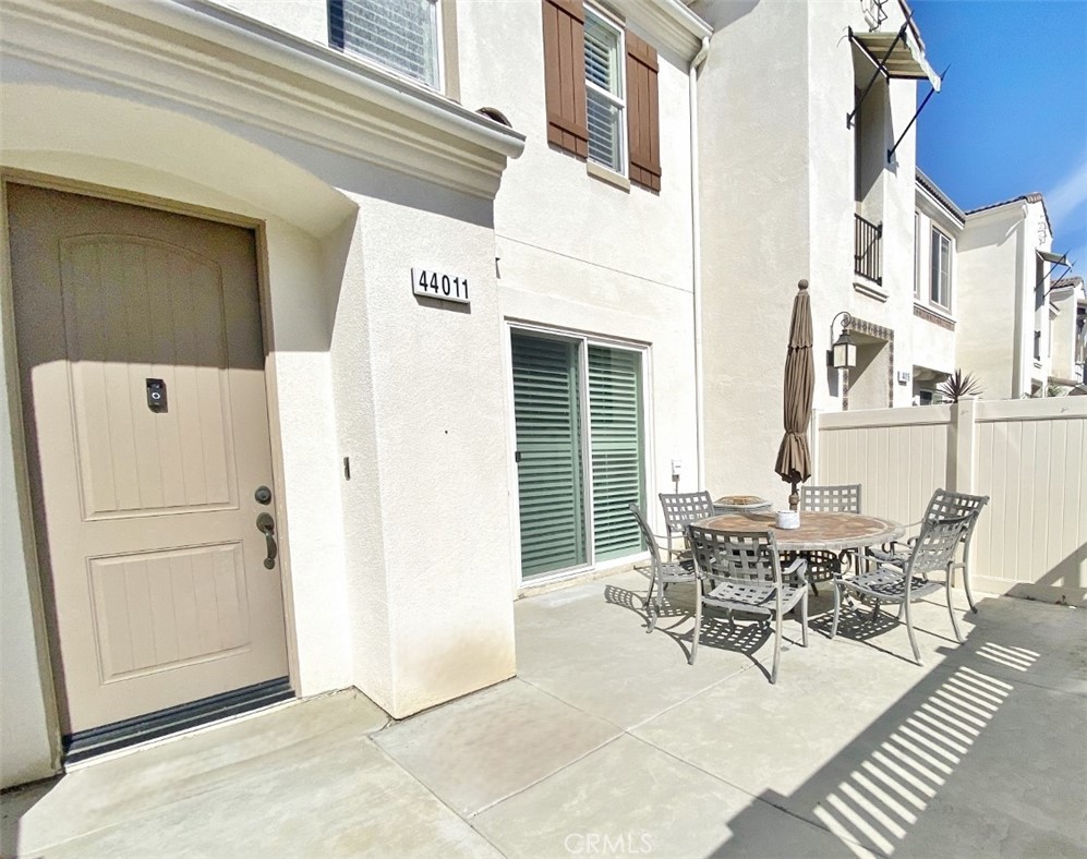 44011 Rivo Court Temecula, CA 92592 - Photo 2 of 39 a view of a dinning tables and chairs in the patio of the house
