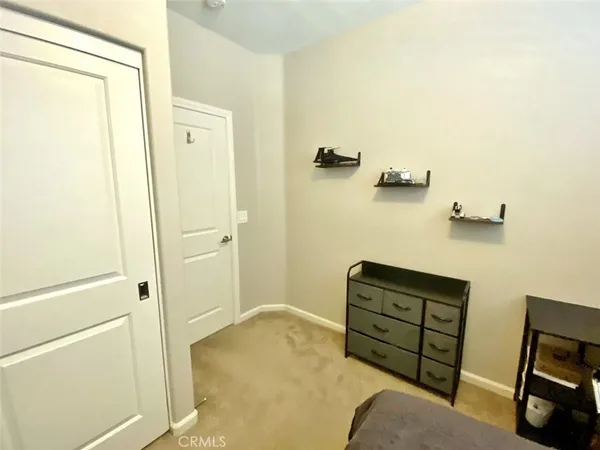 a bedroom with a bed and furniture