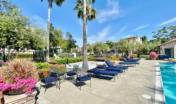 a view of a dinning tables and chairs in the patio of the house