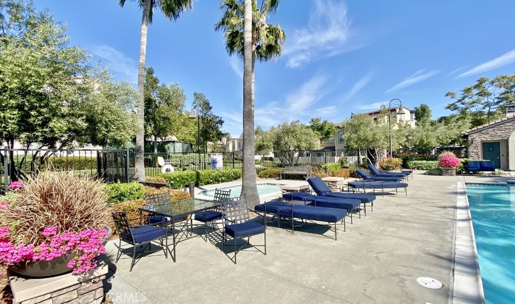 44011 Rivo Court Temecula, CA 92592 - Photo 37 of 39 a view of a patio with couches and table and chairs and potted plants