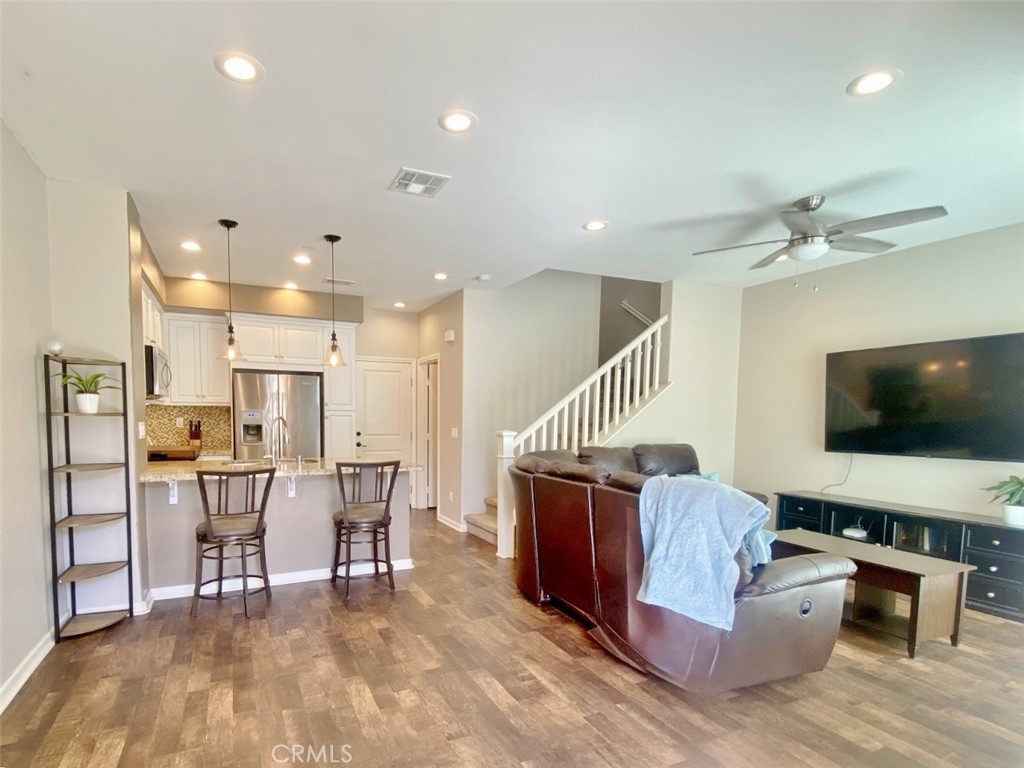 44011 Rivo Court Temecula, CA 92592 - Photo 4 of 39 a living room with furniture and a flat screen tv