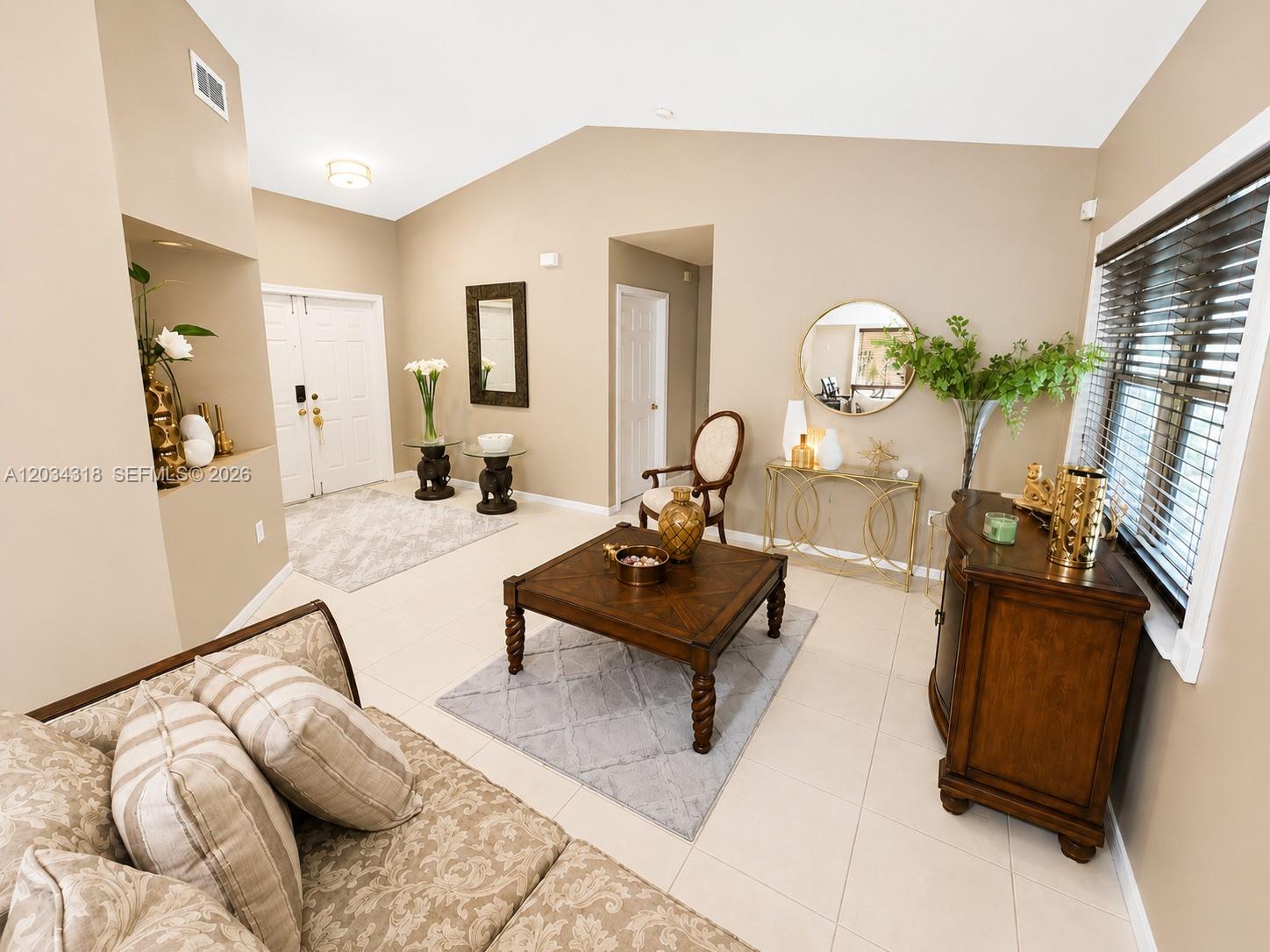14856 Southwest 179th Street Miami, FL 33187 - Photo 8 of 33 a living room with furniture and a mirror