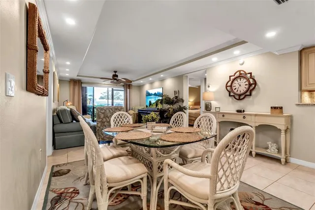 a view of a dining room with furniture and a chandelier