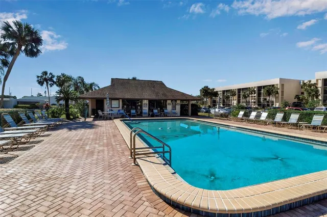 a view of a swimming pool with a patio