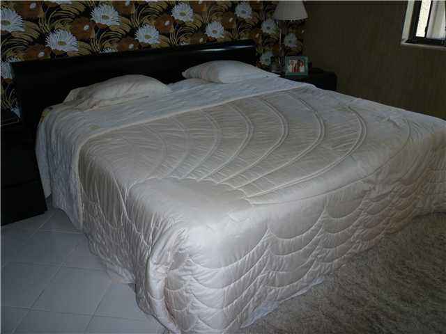 4345 Trevi Court, Unit 208 Lake Worth, FL 33467 - Photo 12 of 20 a bedroom with a bed and a window