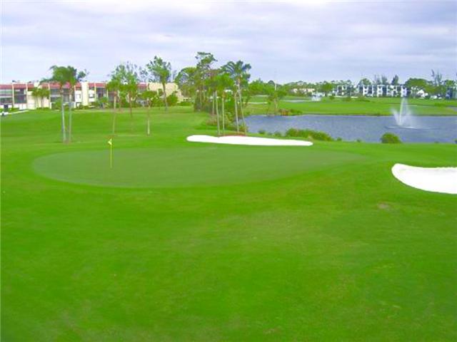 4345 Trevi Court, Unit 208 Lake Worth, FL 33467 - Photo 18 of 20 a view of a golf course with a lake view