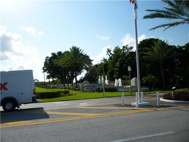 4345 Trevi Court, Unit 208 Lake Worth, FL 33467 - Photo 19 of 20 a view of a street with houses on the side