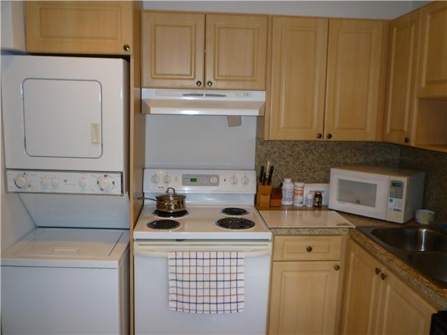 4345 Trevi Court, Unit 208 Lake Worth, FL 33467 - Photo 2 of 20 a kitchen with a sink and cabinets