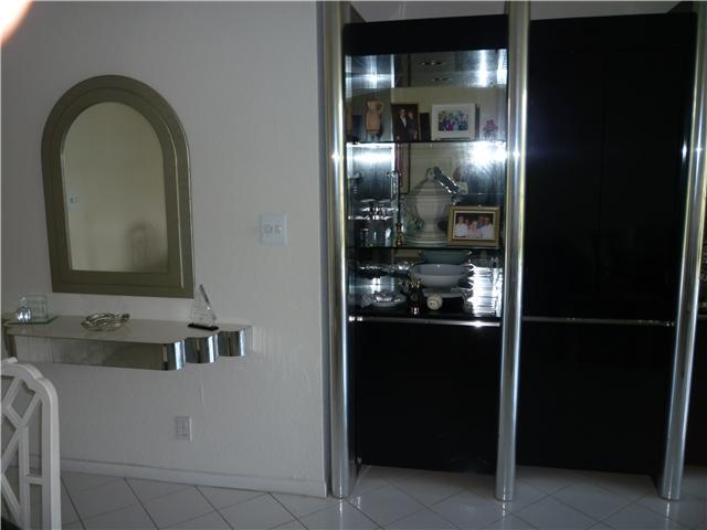 4345 Trevi Court, Unit 208 Lake Worth, FL 33467 - Photo 5 of 20 a view of a bathroom with dual sinks
