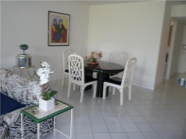 4345 Trevi Court, Unit 208 Lake Worth, FL 33467 - Photo 10 of 20 a dining room with furniture and wooden floor