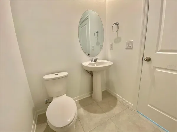 a bathroom with a toilet and a sink