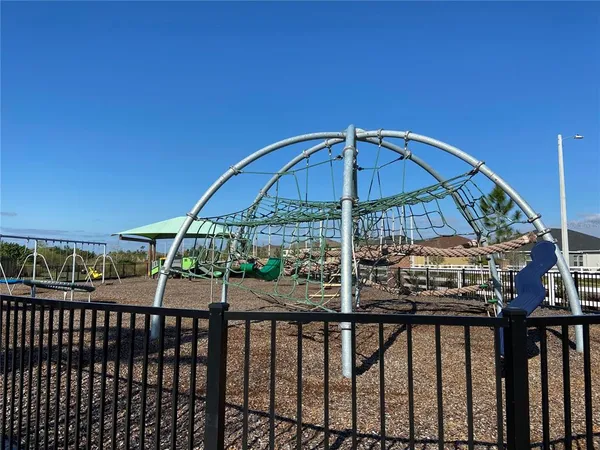 a view of a backyard with sitting area
