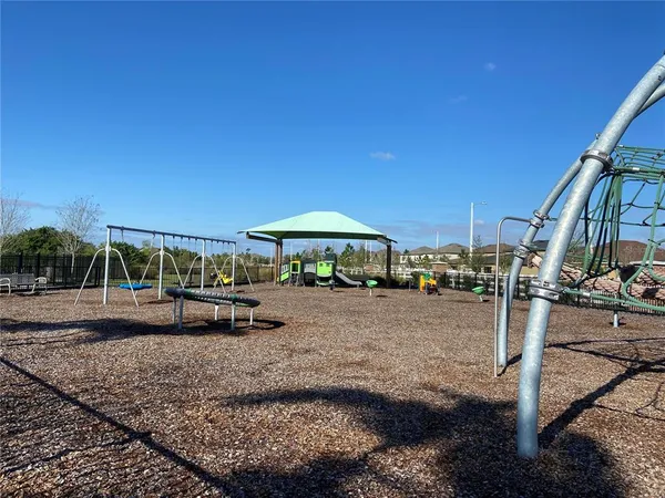 a view of a swimming pool with a yard