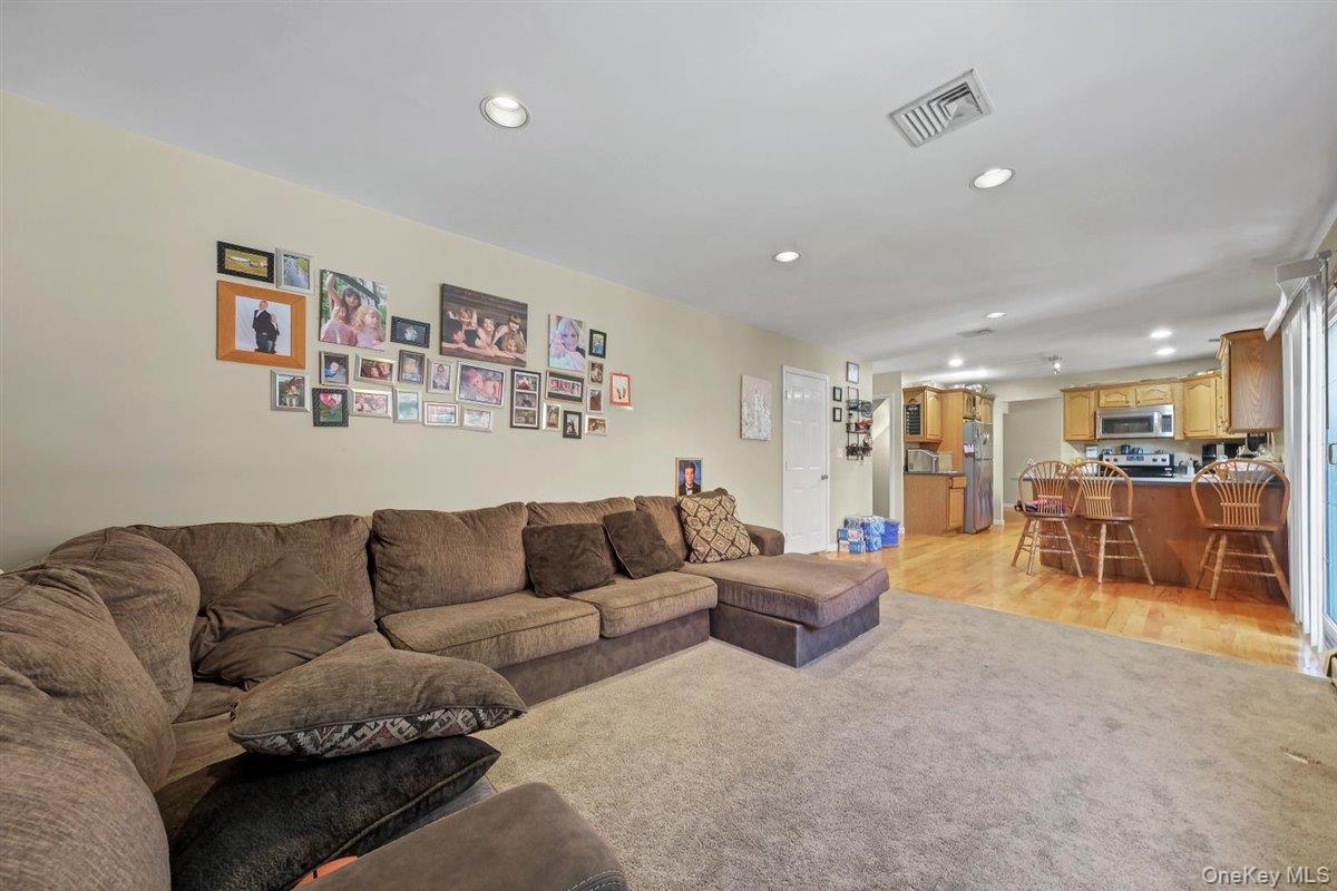 220 Prospect Road Monroe, NY 10950 - Photo 21 of 42 Living area featuring recessed lighting, light colored carpet, and light wood-style flooring