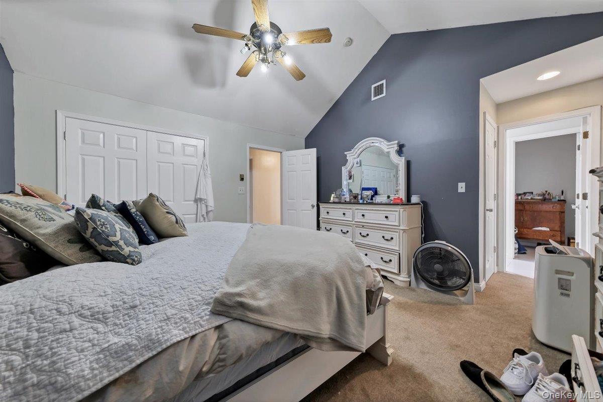 220 Prospect Road Monroe, NY 10950 - Photo 24 of 42 Bedroom with vaulted ceiling, a closet, light colored carpet, and a ceiling fan