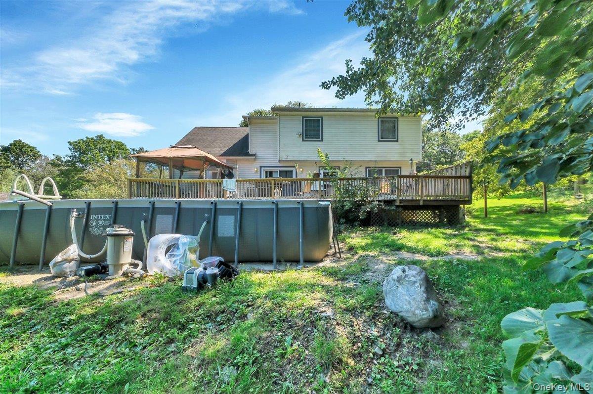 220 Prospect Road Monroe, NY 10950 - Photo 37 of 42 Back of property featuring an outdoor pool and a wooden deck