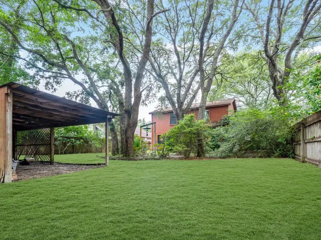 a view of a patio with wooden floor