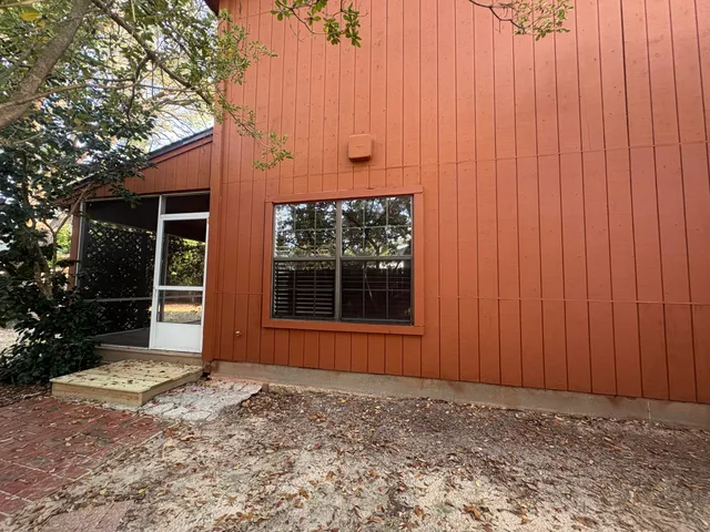 a kitchen with stainless steel appliances granite countertop a sink counter space and a window