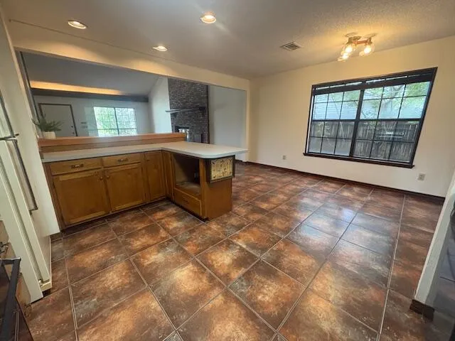a view of a kitchen with a sink and a window